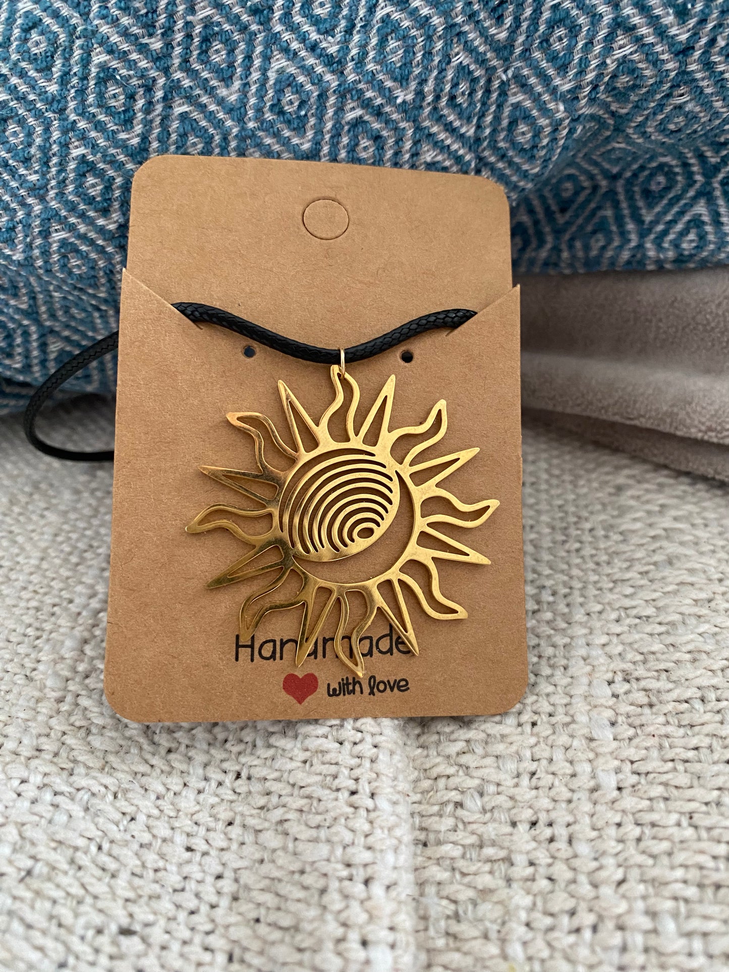 Gold sun black cord