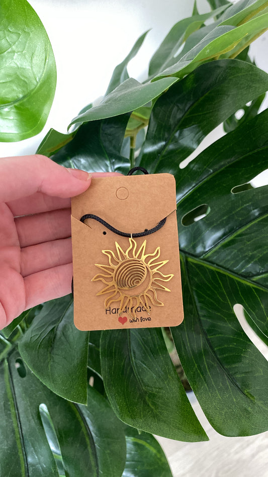 Gold sun black cord
